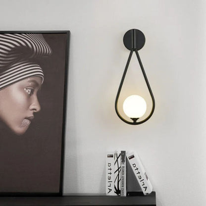 Modern Gold Wall Sconce with Frosted Glass Globe